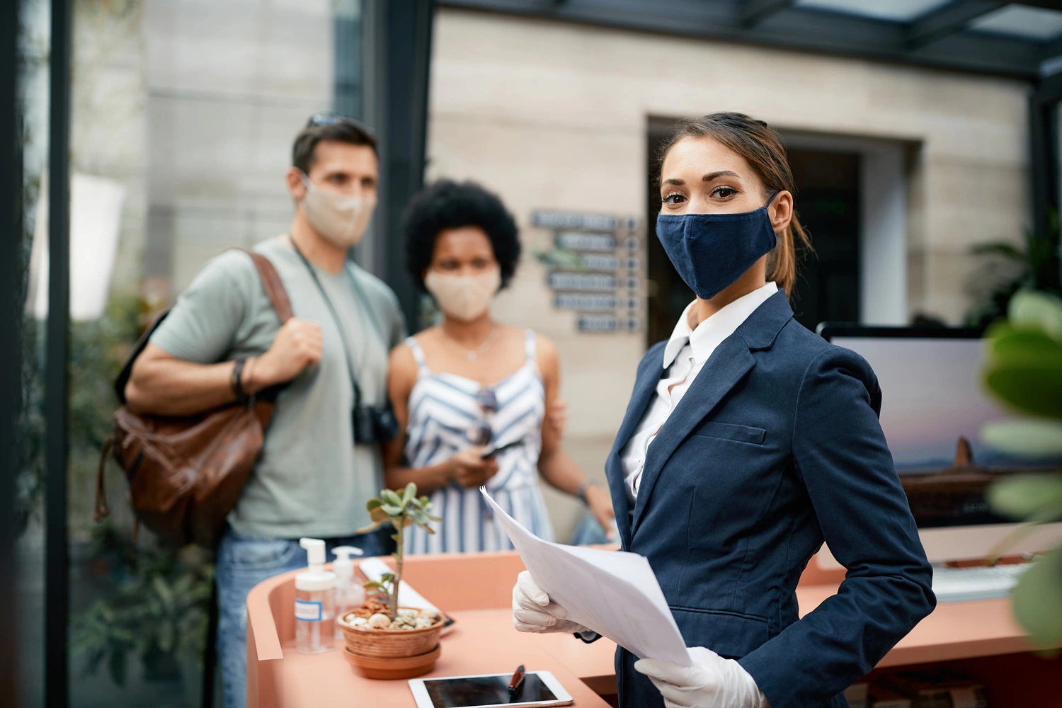 hotel guests wearing masks